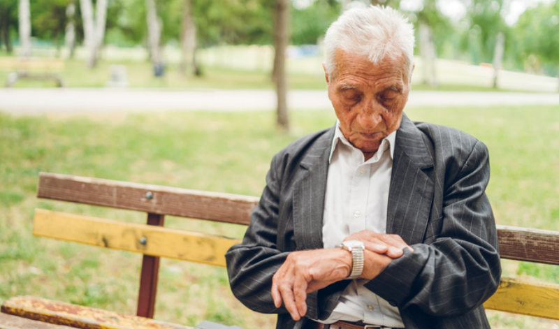 old man checking his watch