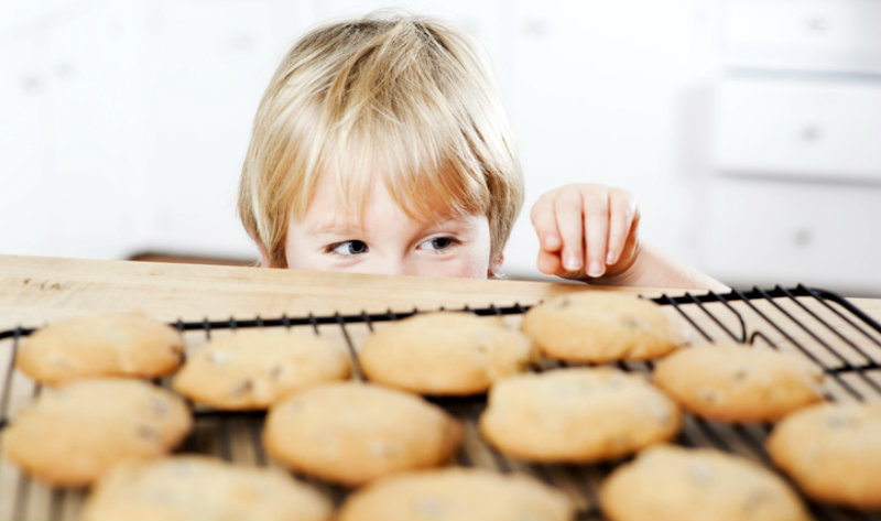 boy sneaking a cookie
